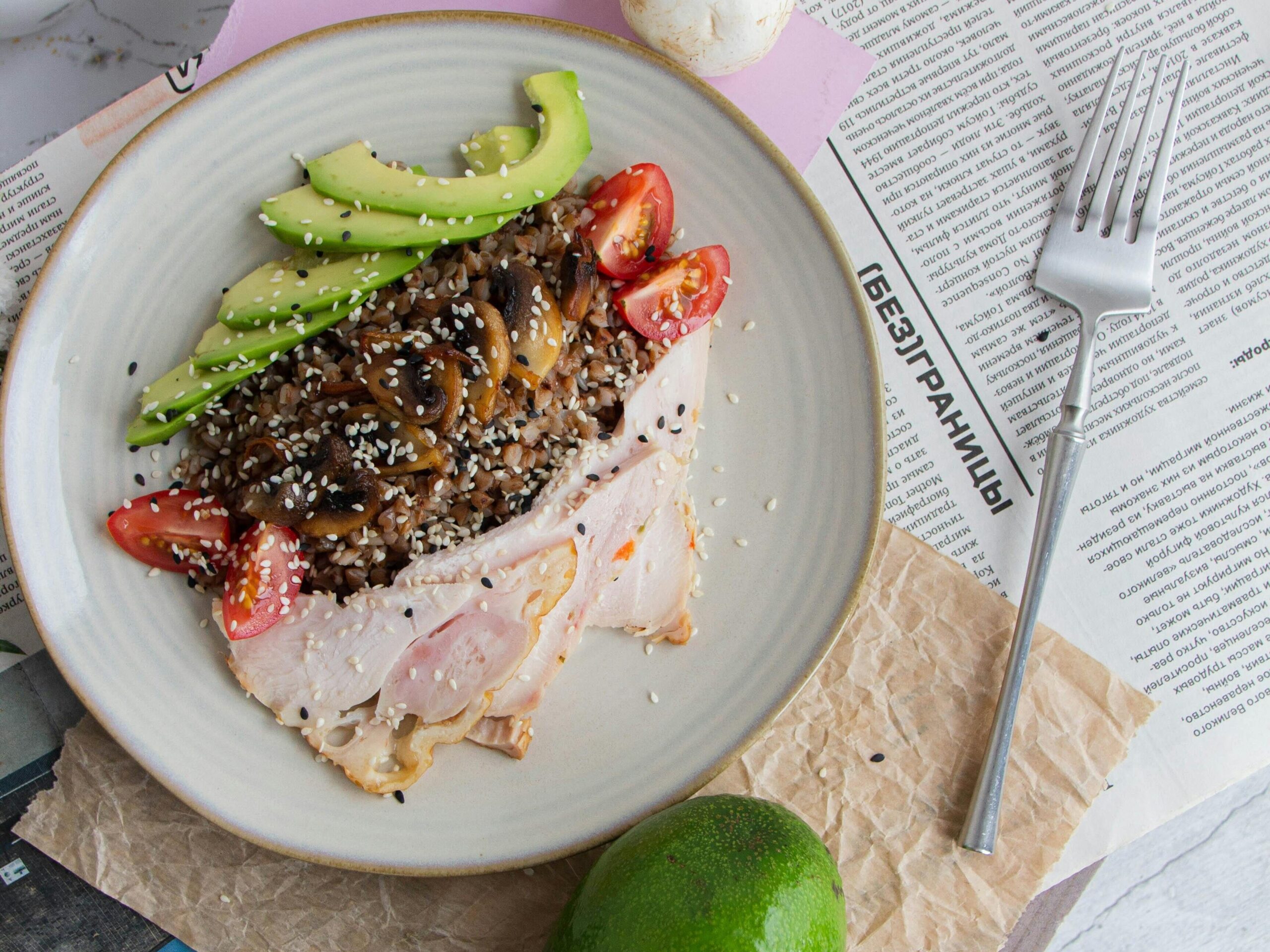 A healthy plate with turkey, avocado, tomatoes, and rice, offering a balanced meal for post-swim recovery